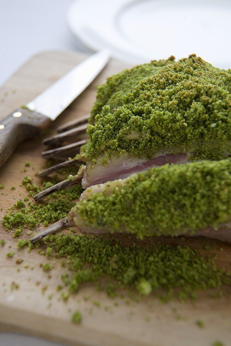 Rack of Lamb with Herb Crust on Cutting Board; Sliced