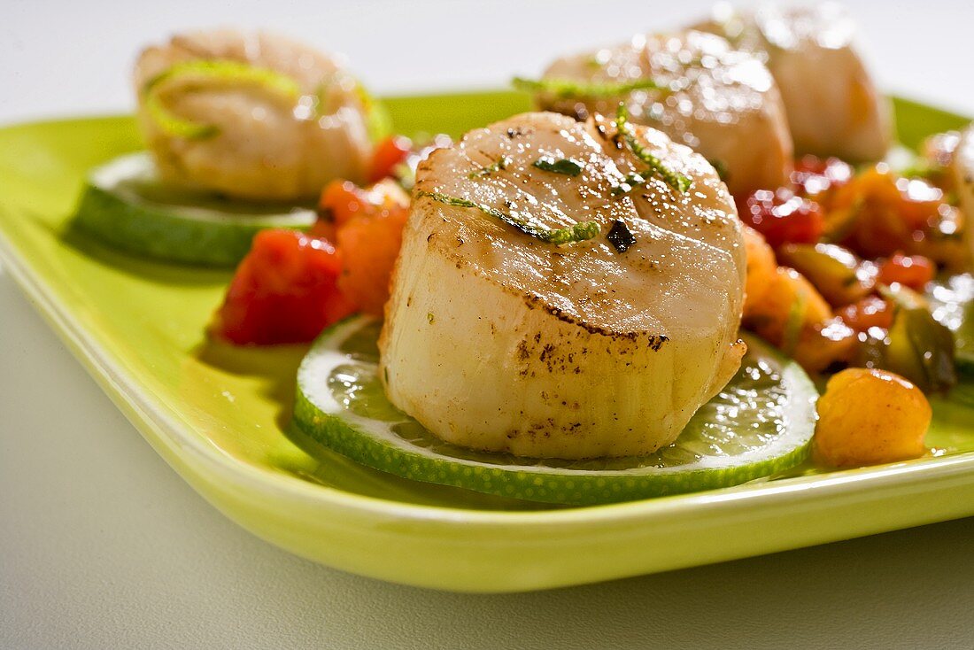 Lime Grilled Scallops on Lime Slices on Green Plate