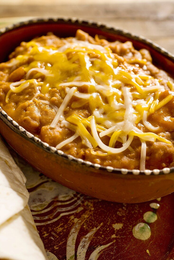 Frijoles Refritos; Refried Beans Topped with Cheese