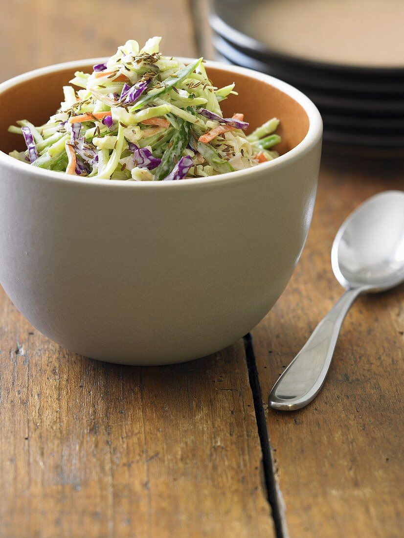 Bowl of Cole Slaw on Wooden Table