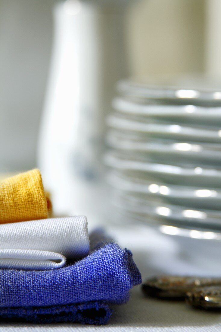 Blue, White and Yellow Cloth Napkins; Folded and Stacked