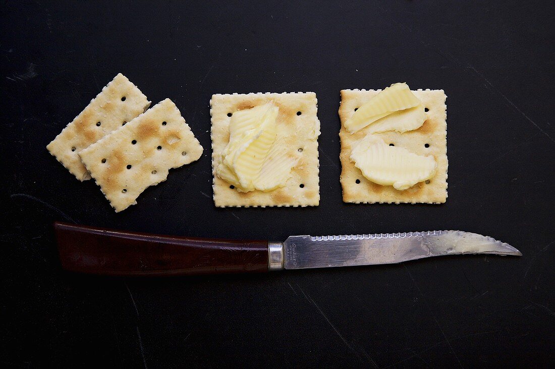 Saltine Crackers with Butter; Knife