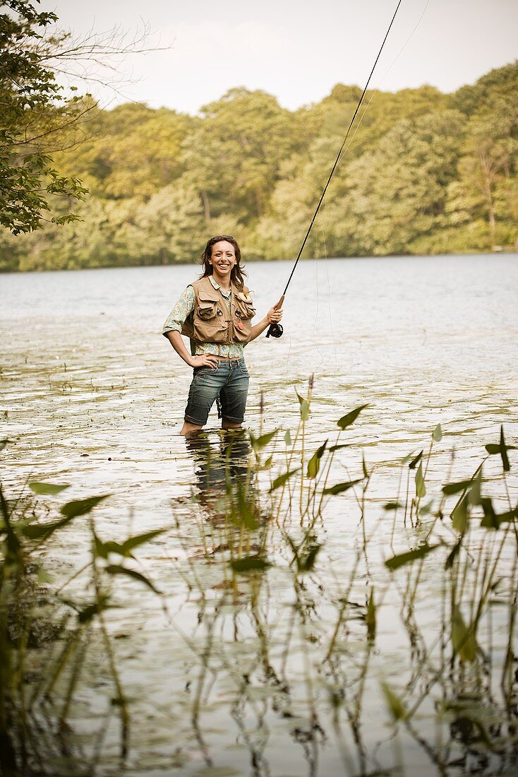 Woman with Fly Rod in River