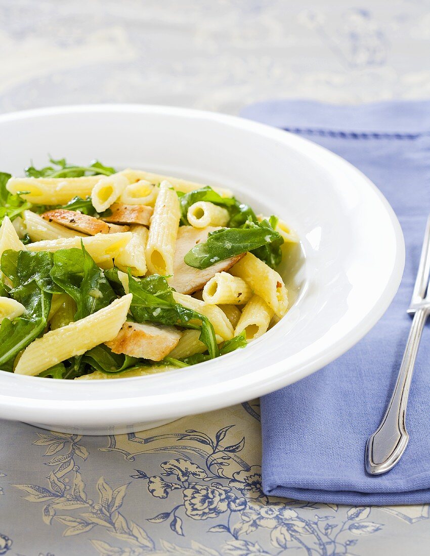 Penne Pasta, Chicken and Arugula in a Bowl