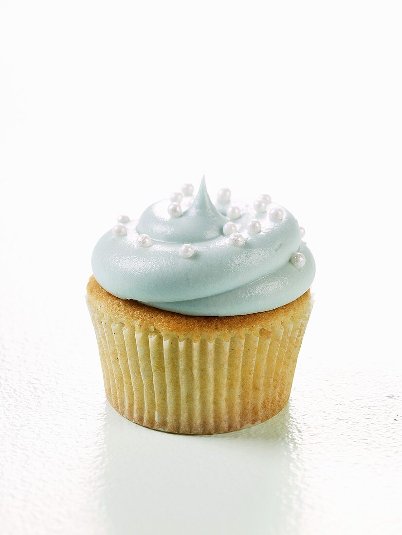 Vanilla Cupcake Decorated with Blue Frosting and Candy Pearls