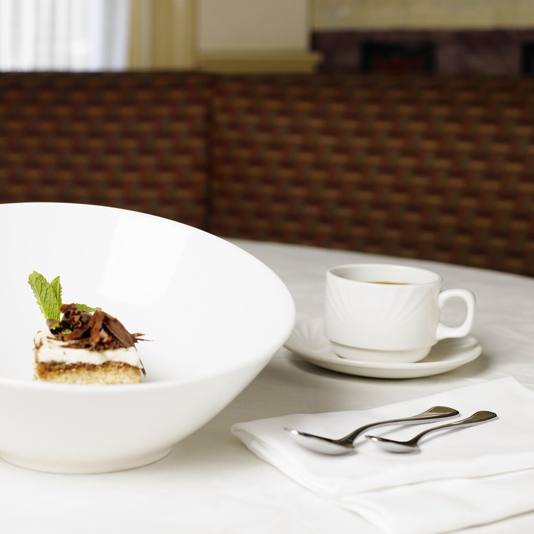 Tiramisu in Large White Bowl; Cup of Tea