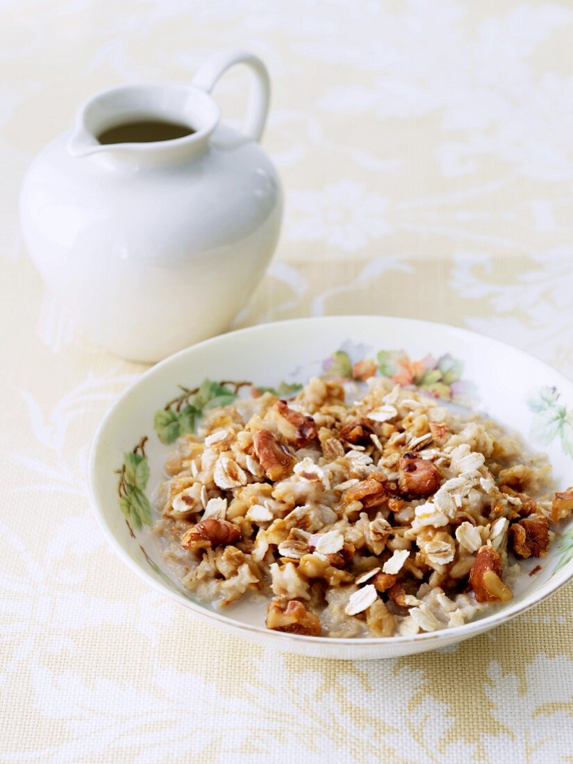 Bowl of Oatmeal with Walnuts and Maple Syrup