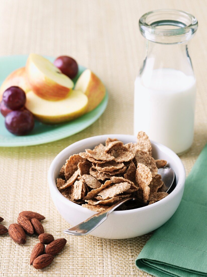 Bowl of Bran Flake Cereal with Nuts, Milk and Fruit