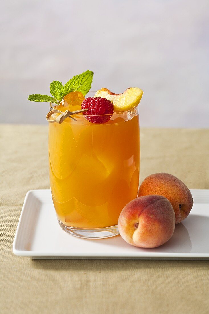 Peach Cocktail with Raspberry Peach Garnish