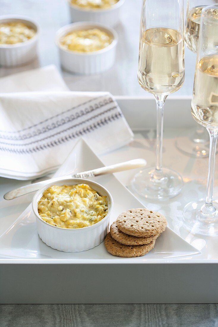 Hot Clam Dip with Crackers and Glasses of White Wine