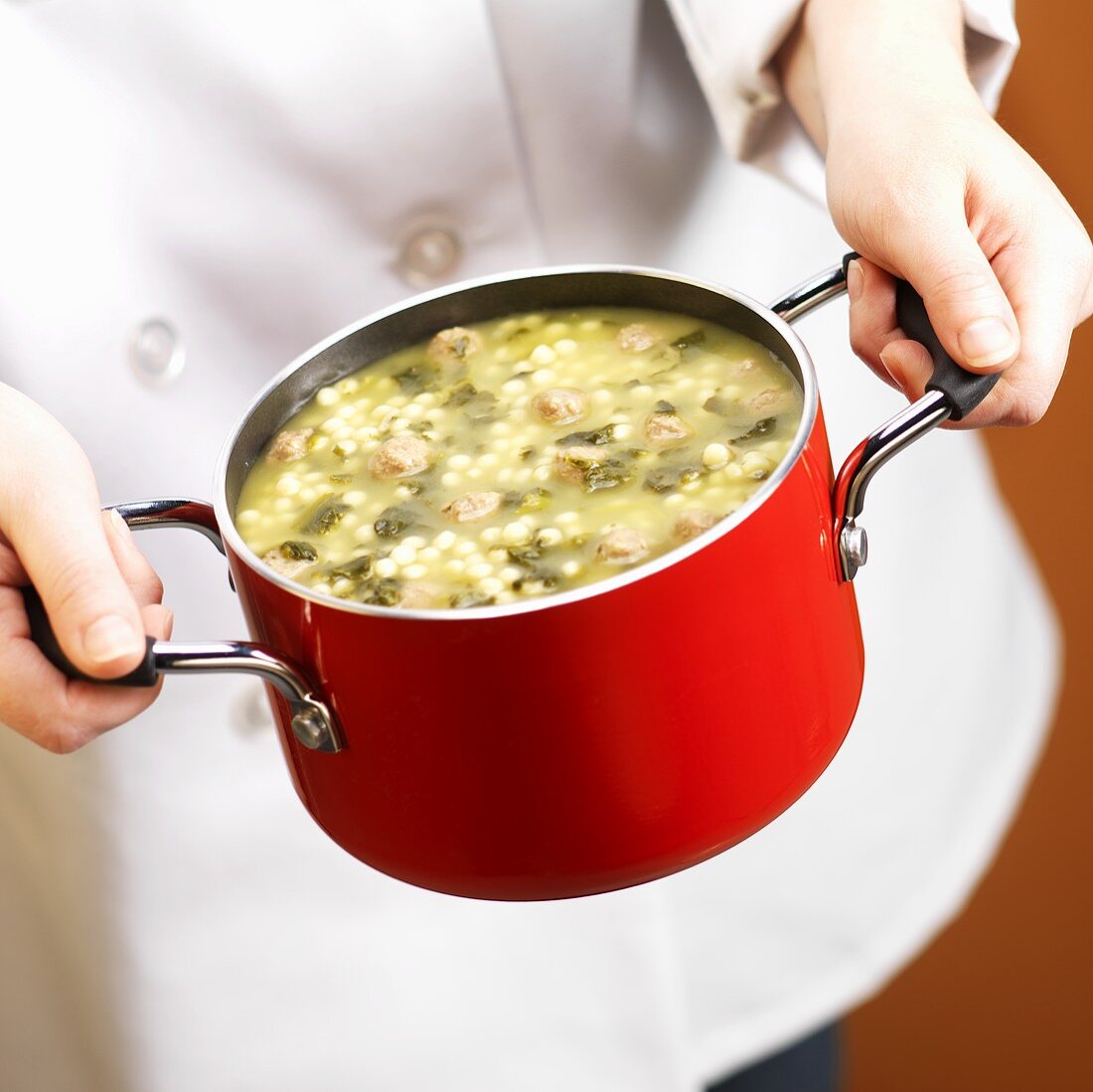Chef Holding a Pot of Italian Wedding Soup