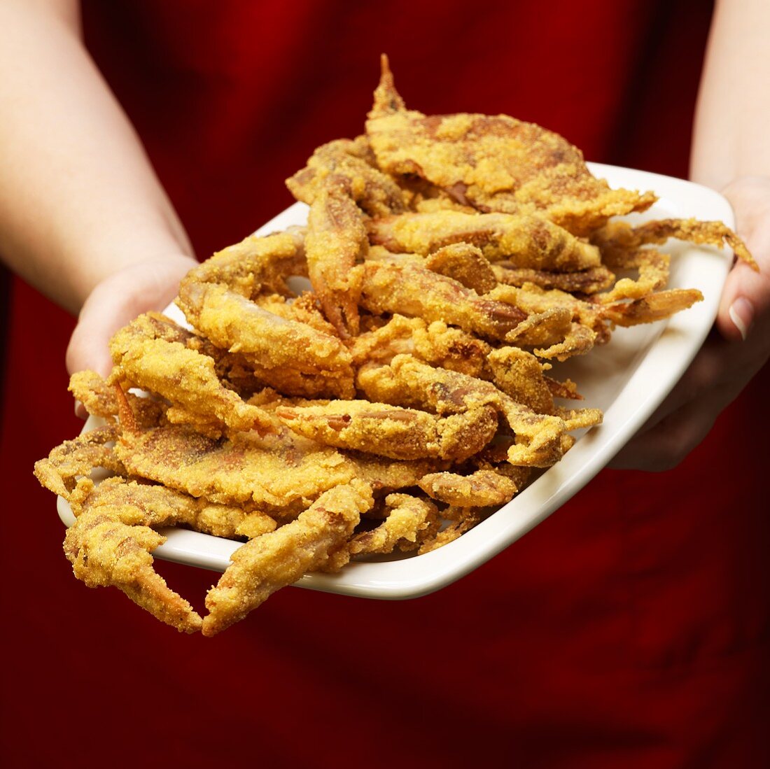 Person Holding Platter of Fried Soft Shell Crabs