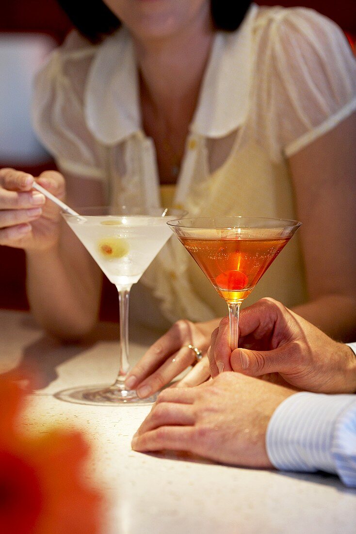 Couple with Cocktails; Martini and Manhattan 