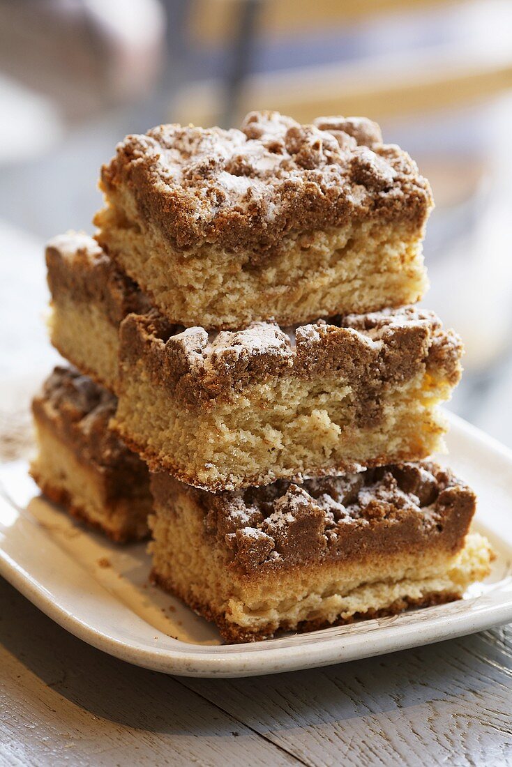 Squares of Maple Coffee Cake Stacked on a Plate