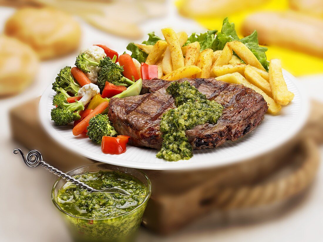 Grilled Rib Eye Steak with Herb Sauce, Fries and Veggies