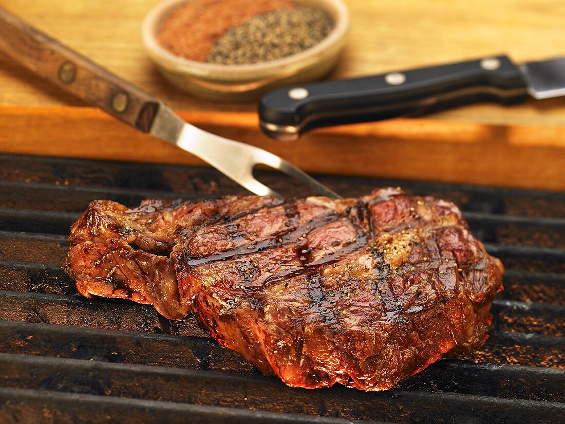 Steak on the Grill with Carving Fork