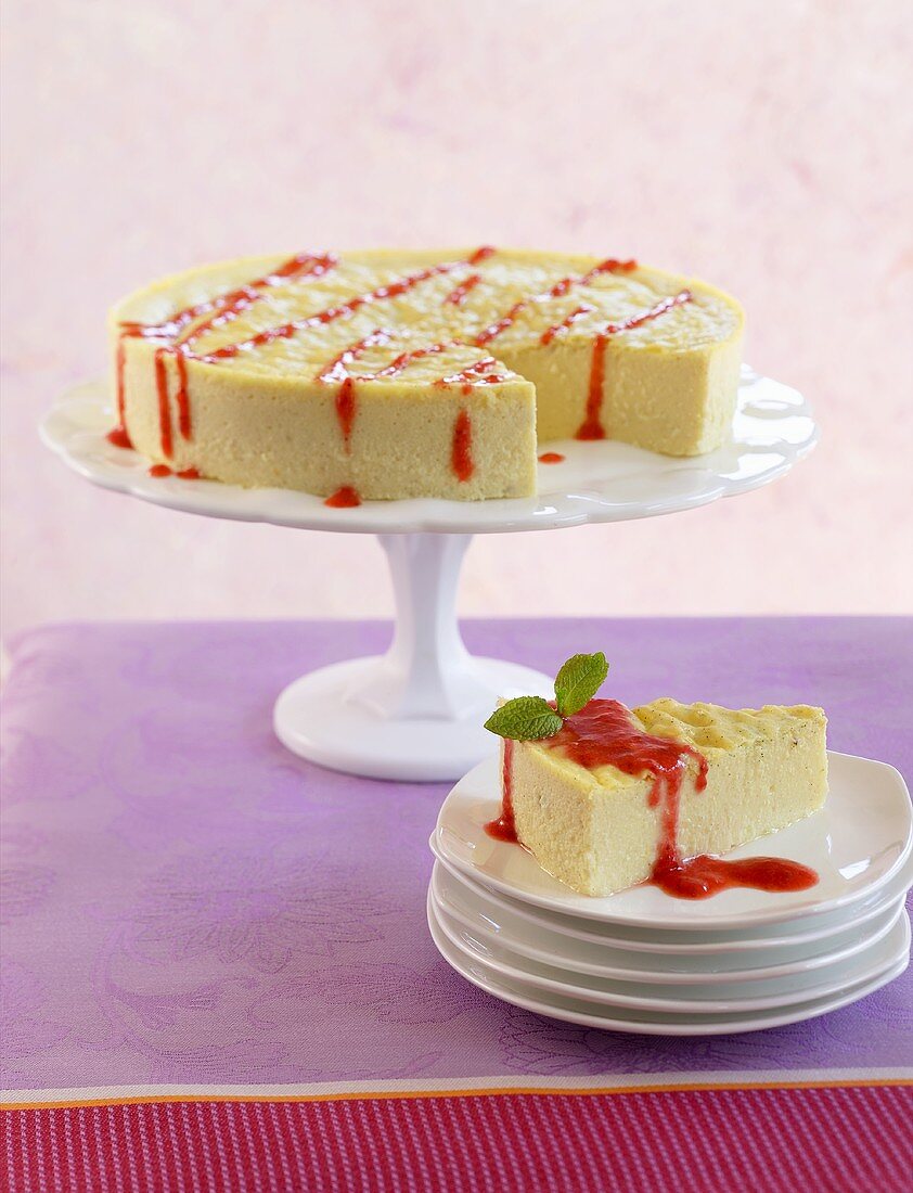 Slice of Cheesecake on Stacked Plates; Cheesecake with Slice Removed