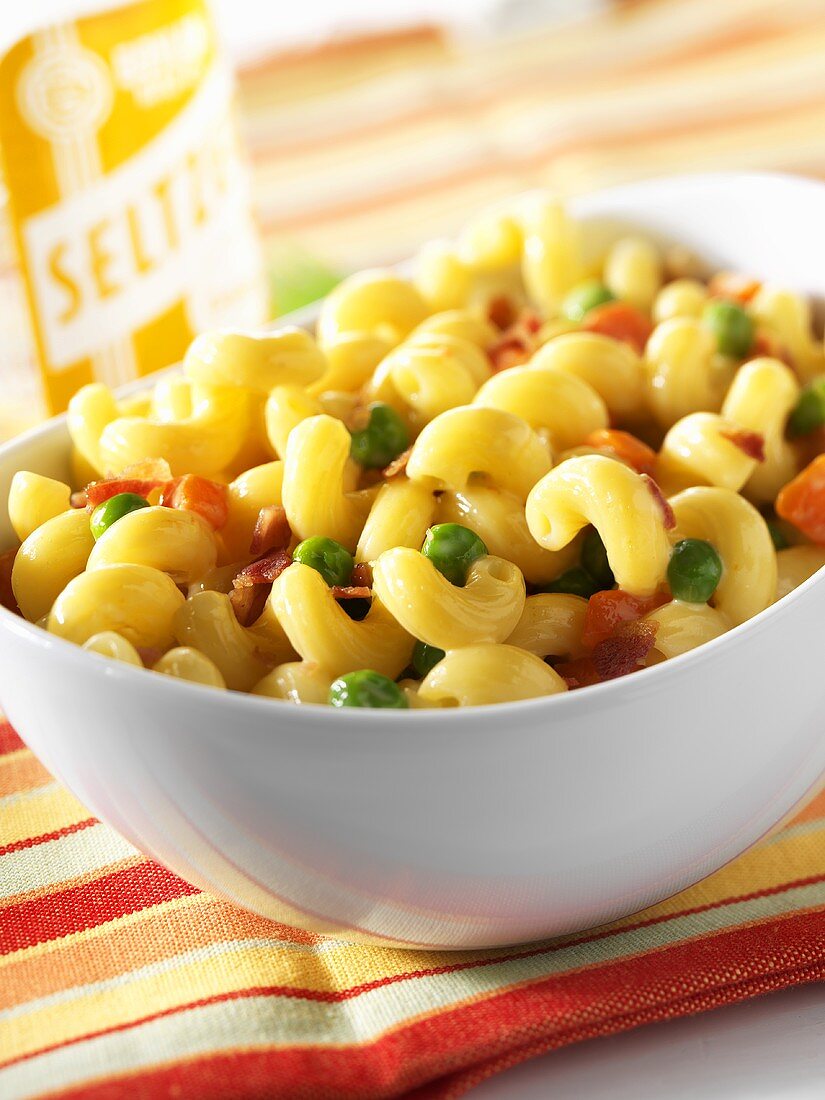 Macaroni and Cheese Made with Corkscrew Pasta and Peas