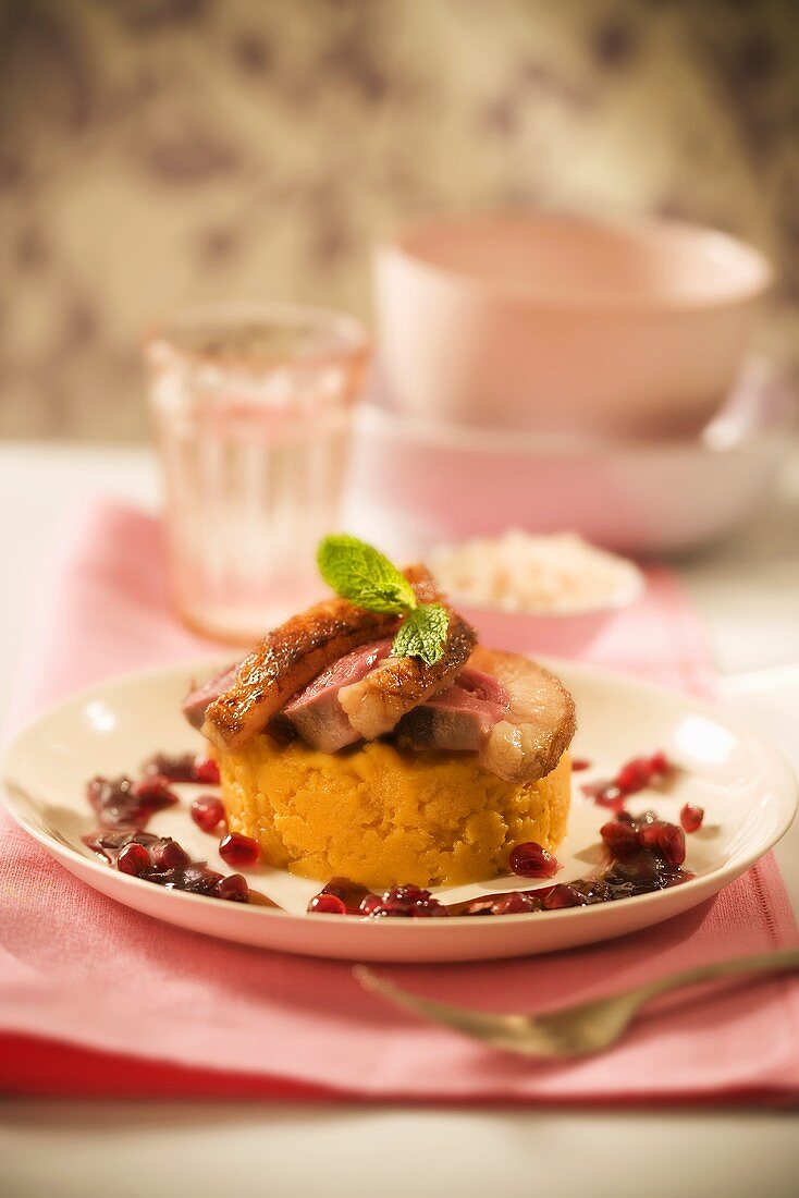 Sliced Duck on Sweet Potato Puree with Pomegranate
