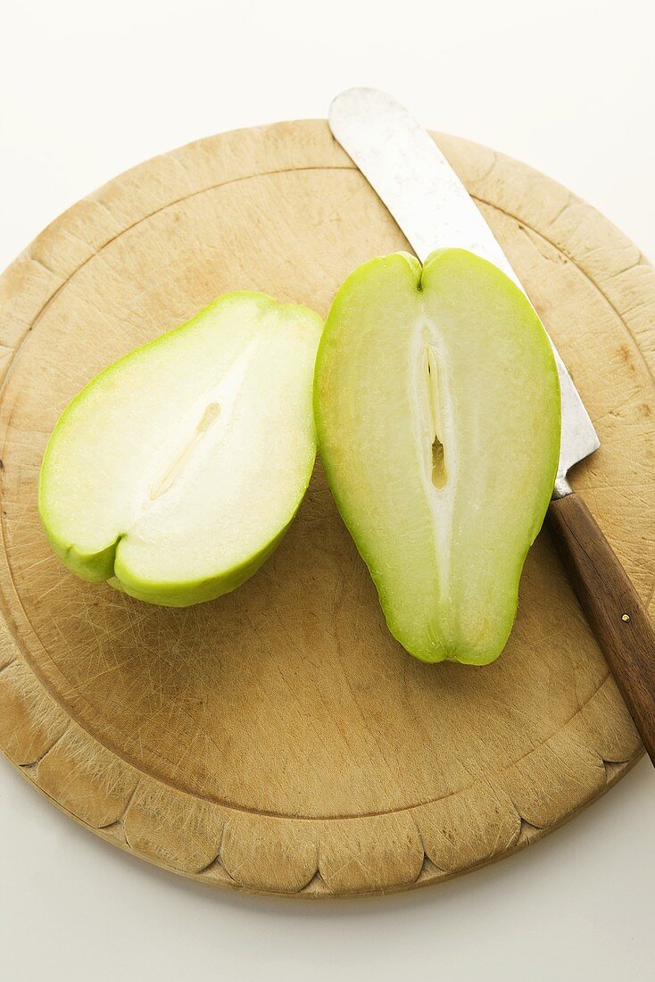 Halved Chayote on Cutting Board