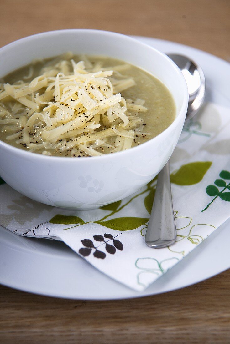 Bowl of Brussels Sprout Soup with Shredded Cheese