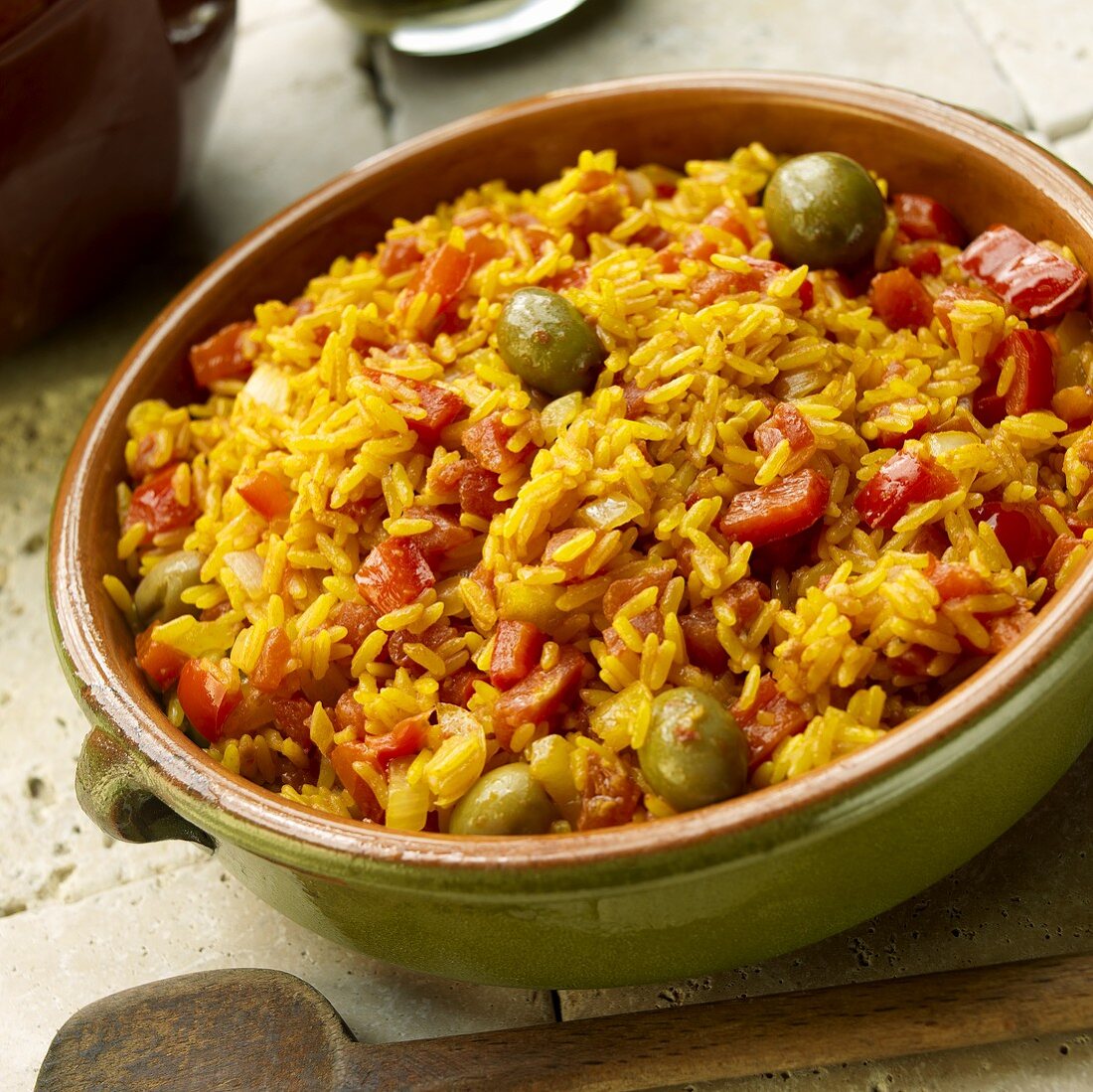 Spanish Rice with Green Olives, Red Peppers and Tomatoes in Earthenware Bowl