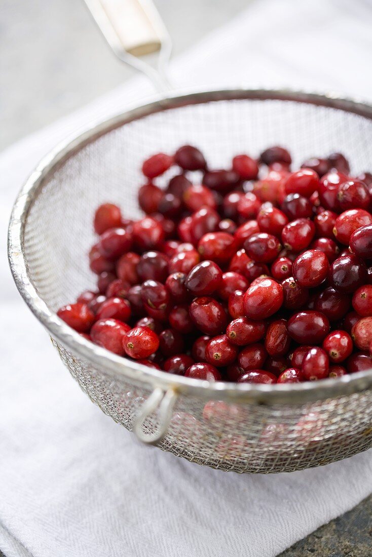 Cranberries in a Colander on Dish Cloth