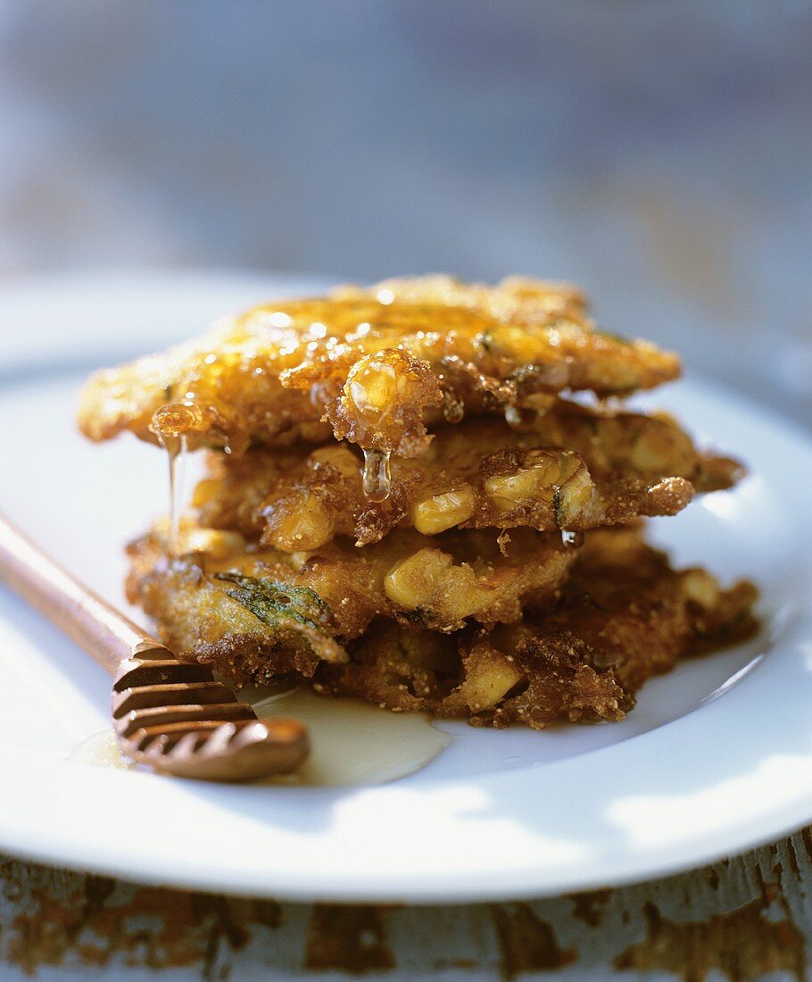 Stacked Fried Corn Fritters with Honey
