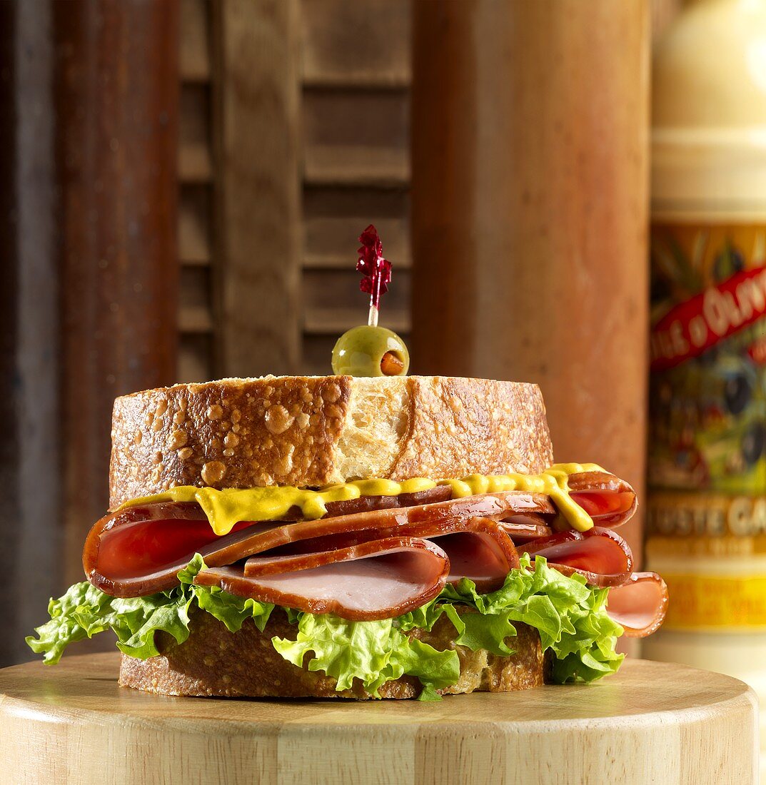Ham, Mustard and Lettuce Sandwich with Olive Toothpick
