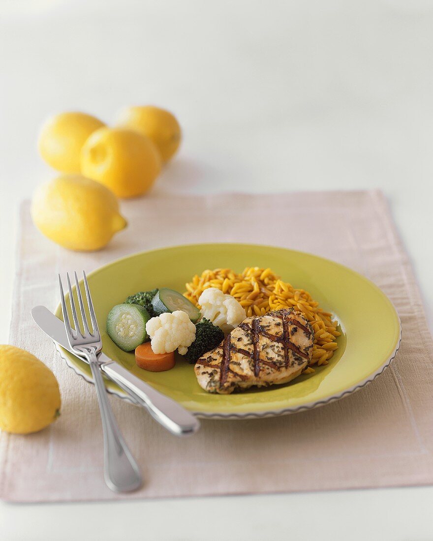 Grilled Chicken Breast with Saffron Risotto and Veggies