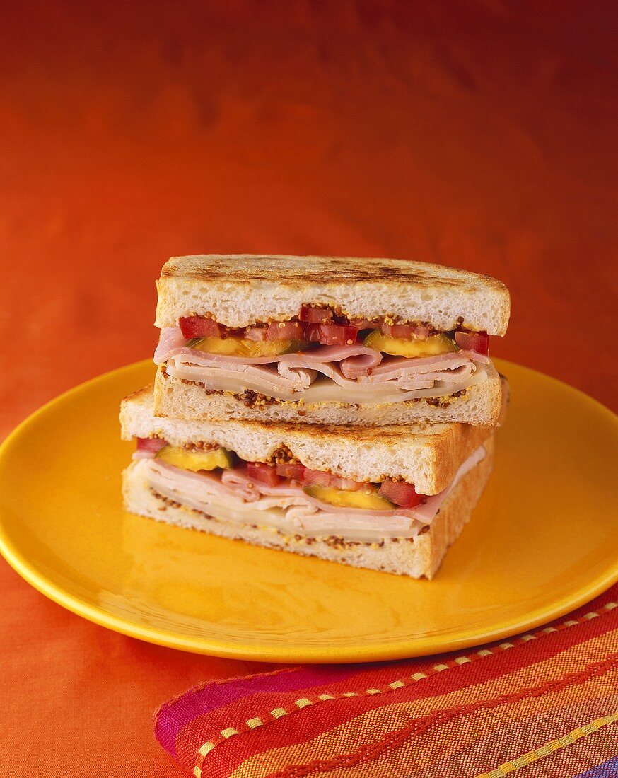 Cuban Sandwich on Toasted Bread; Halved and Stacked 