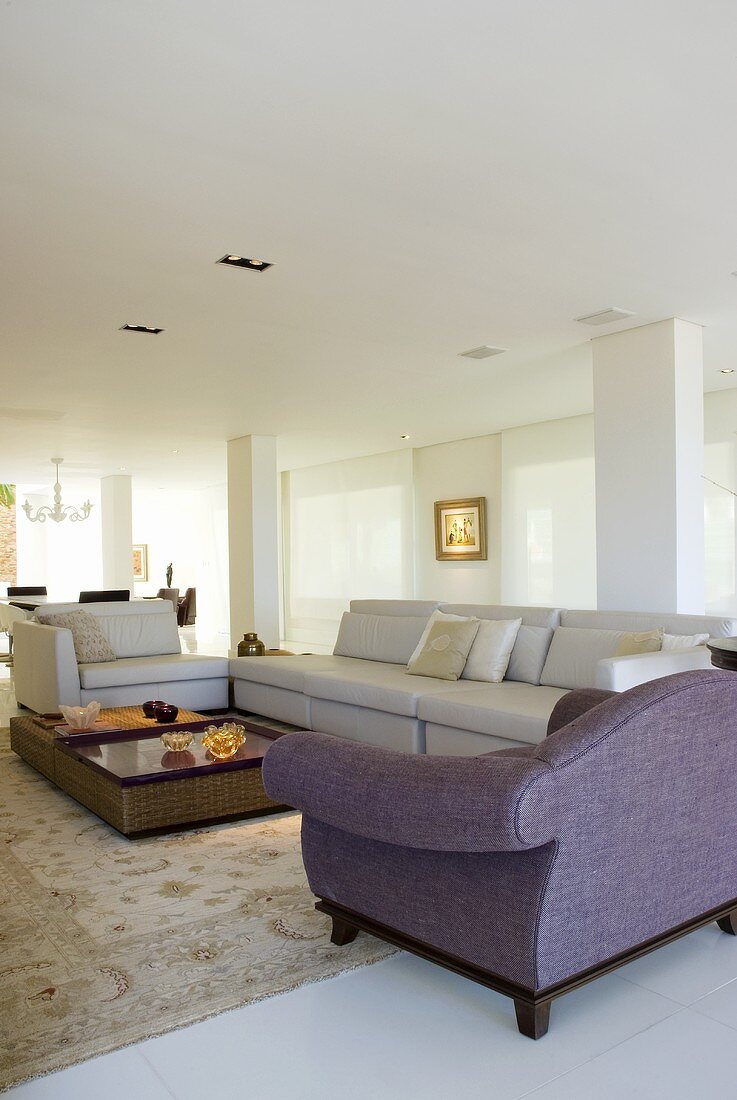 An elegant living room with seats and a coffee table