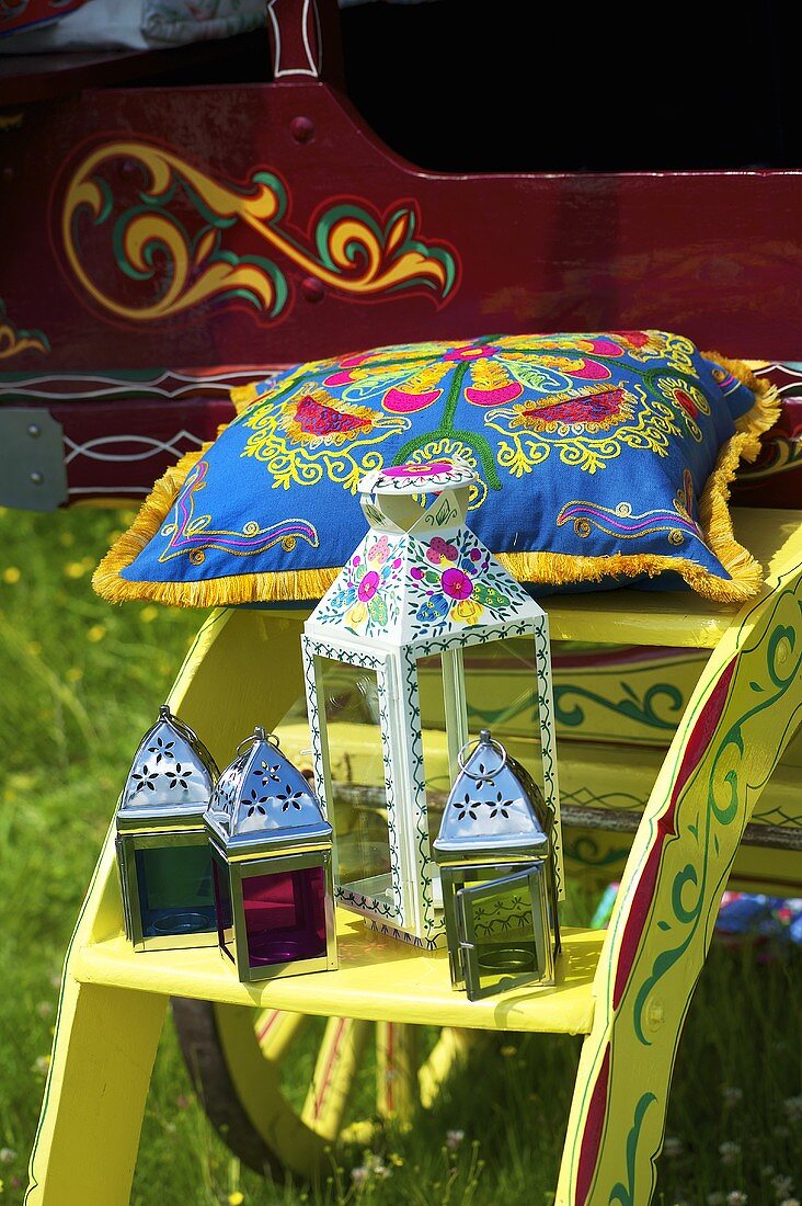 Lanterns and an ethnic cushion on steps