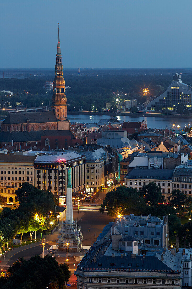 View from Radisson Blue Hotel over the old town at night, liberty monument, St. Petri church, Daugava river, National Library, old town, Riga, Latvia