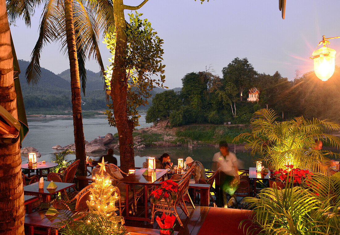 Restaurant along the mekong river and river Nam Khan, Luang Prabang, Laos, Asia