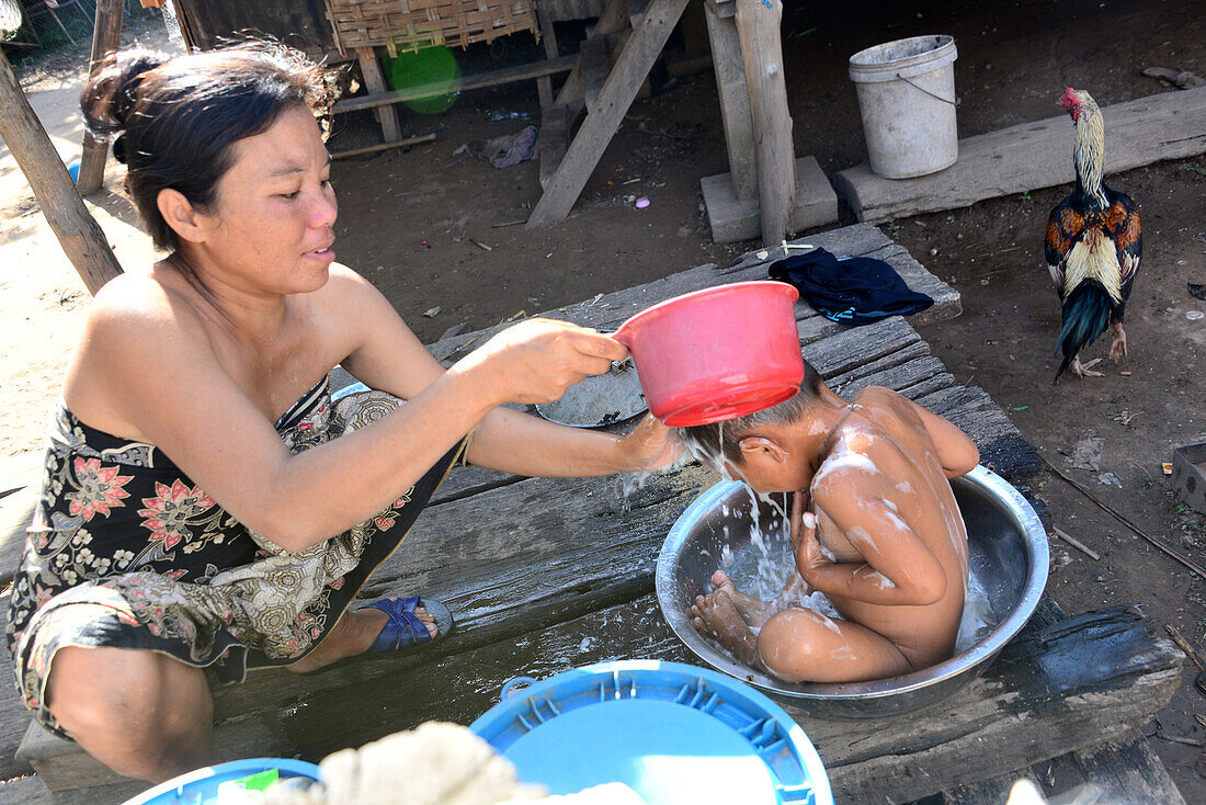 Boy having a wash, Island of Don Khon, 1000 island, south-Laos, Laos, Asia