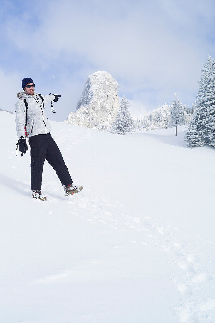 Snowboarder off piste in a winter landscape, Kampenwand, Alps, Bavaria, Germany