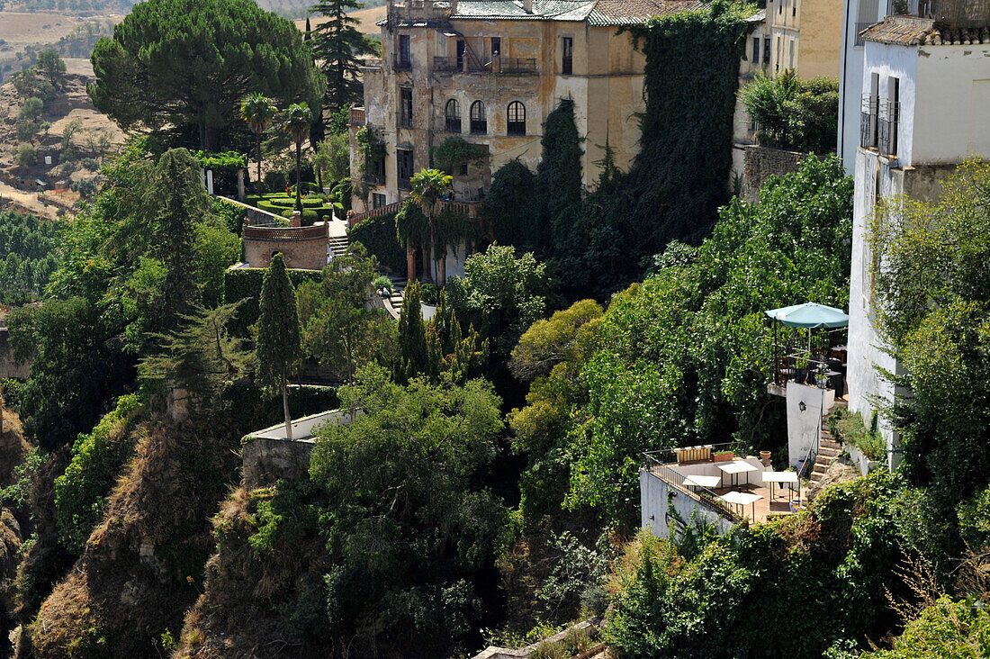 Gardens and houses at the gorge in the old town of Ronda, Malaga Province, Andalusia, Spain
