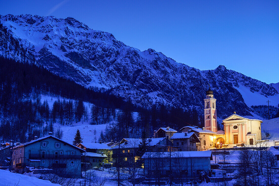 Illuminated church and village of Chialvetta, Chialvetta, Valle Maira, Cottian Alps, Piedmont, Italy