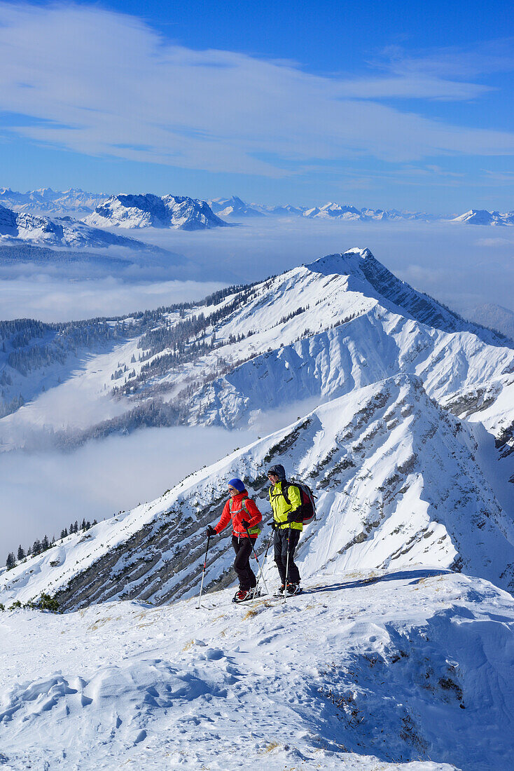 Two persons back-country skiing, Reifelberge in background, Sonntagshorn, Chiemgau range, Salzburg, Austria