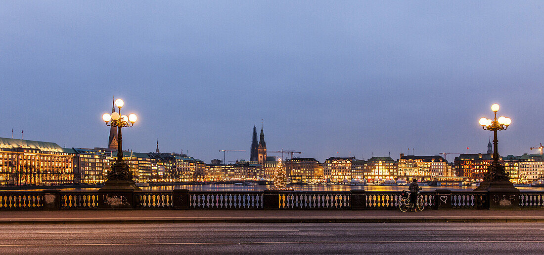 view from the Lombards bridge over the Binnenalster to Jungfernstieg and town hall at dusk at Christmas, Hamburg, Germany
