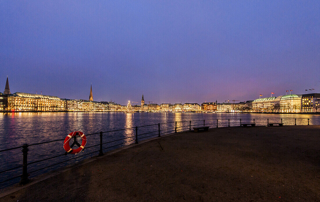 View over the Binnenalster to Jungfernstieg and the town hall at dusk at Christmas, Hamburg, Germany