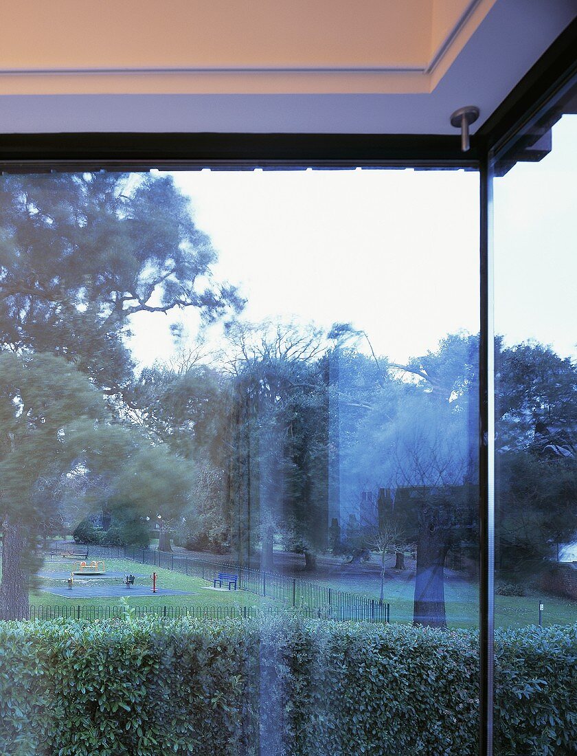 A corner window bank with a view of the garden