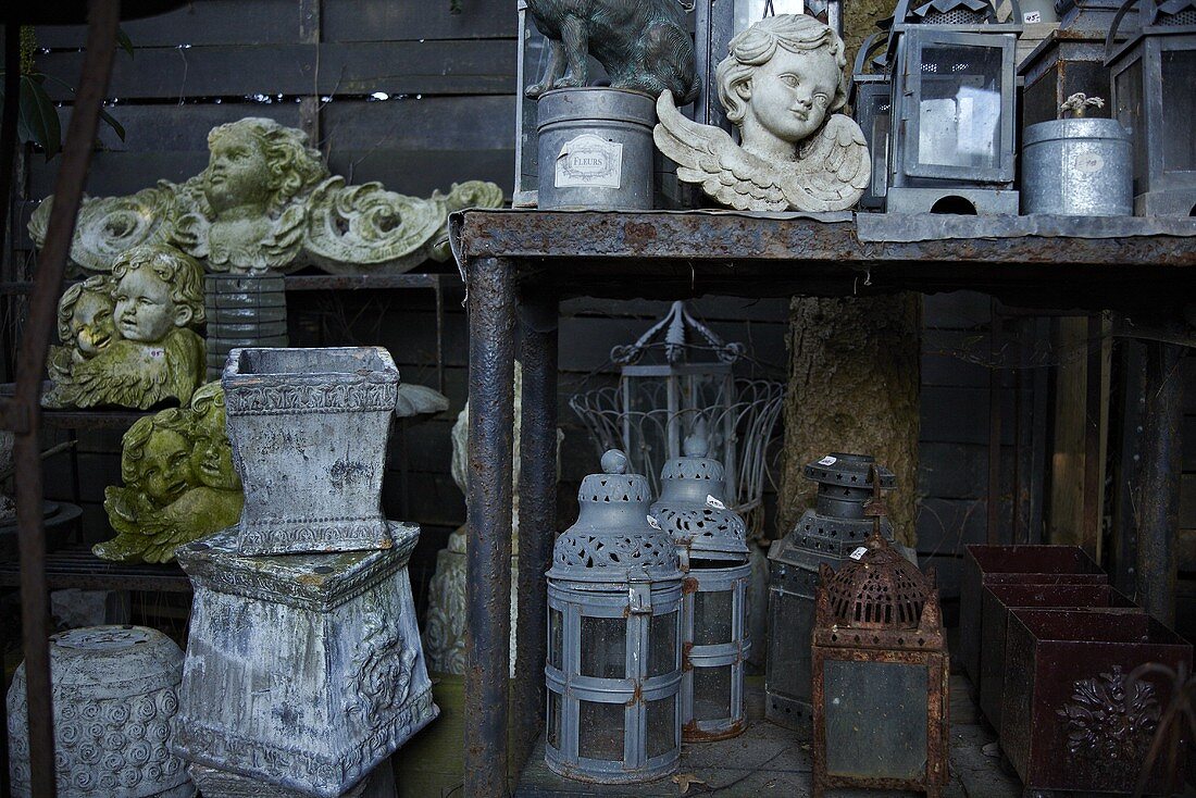 Old garden ornaments (plant pots, lanterns, stone angel)