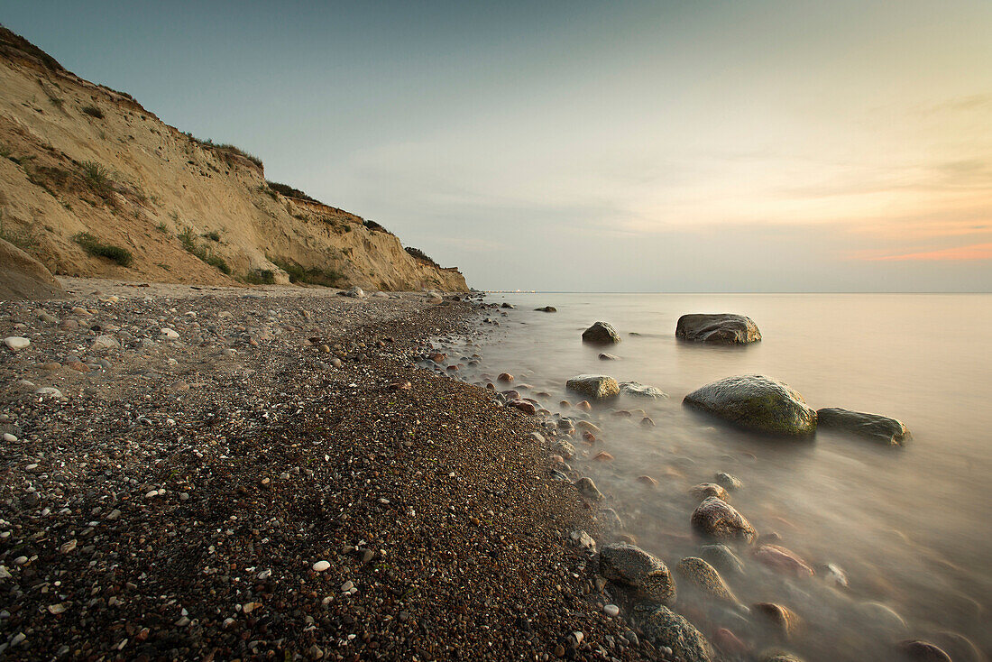 Large stones on a pebble beach at the Baltic Sea in the evening mood, Wustrow, Darss, Mecklenburg Vorpommern, Germany