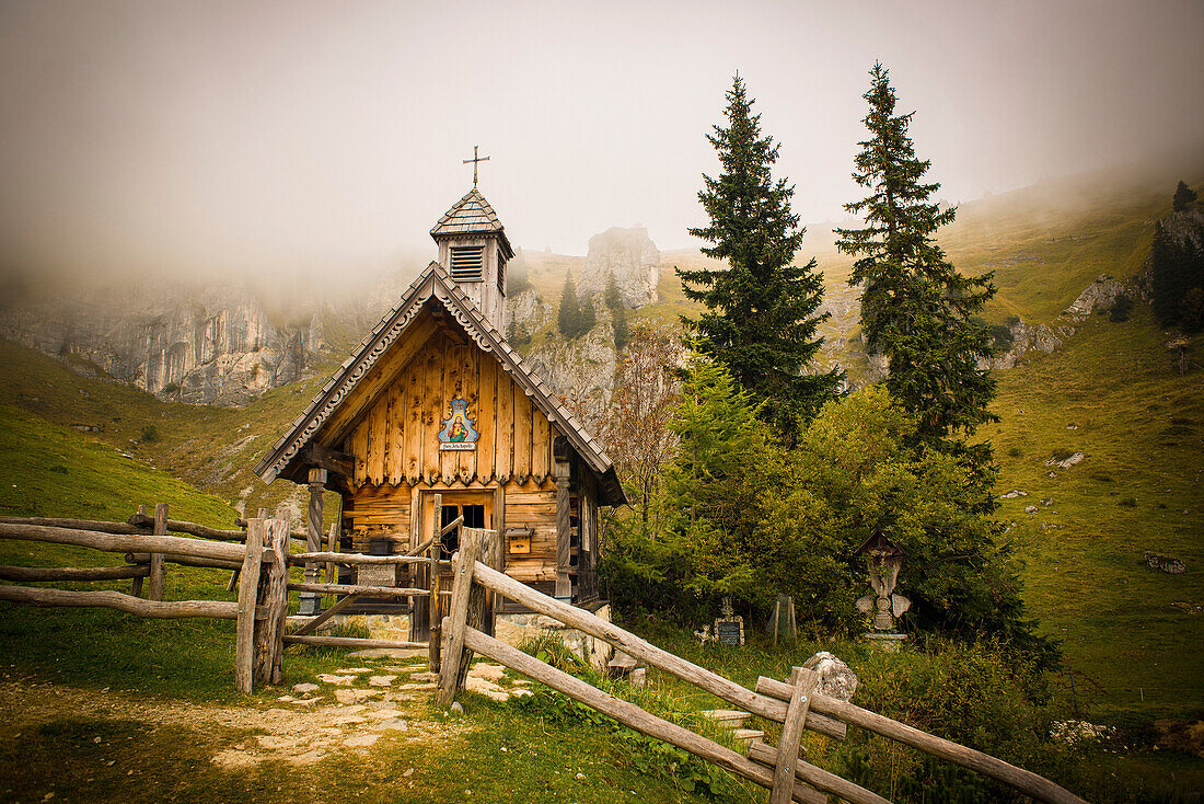 Herz-Jesu-Chapel at Stie-Alm in front of fog-shrouded mountains, Brauneck, Lenggries, Alps, Bavaria, Germany