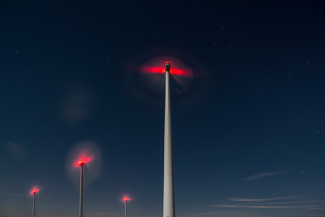 Wind turbines in the night sky, Rhade, Nordrhein-Westfalen, Germany