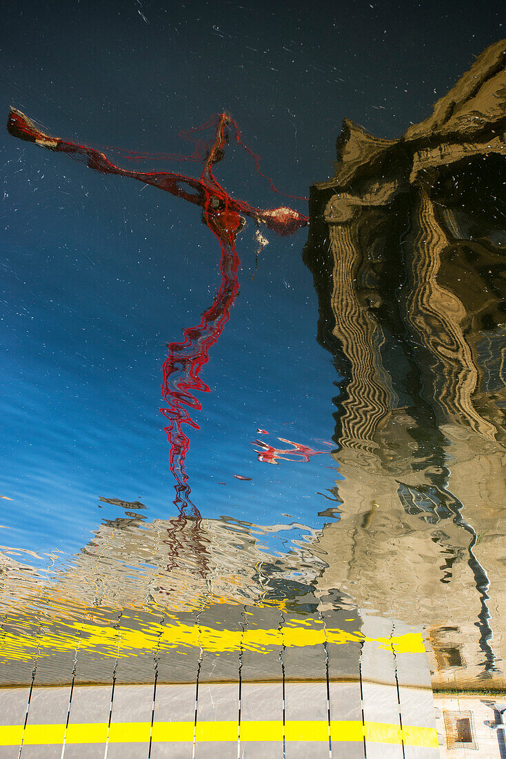 Crane reflected in the Spree in front of the Pergamon Museum on Museum Island in Berlin Mitte, Berlin, Germany