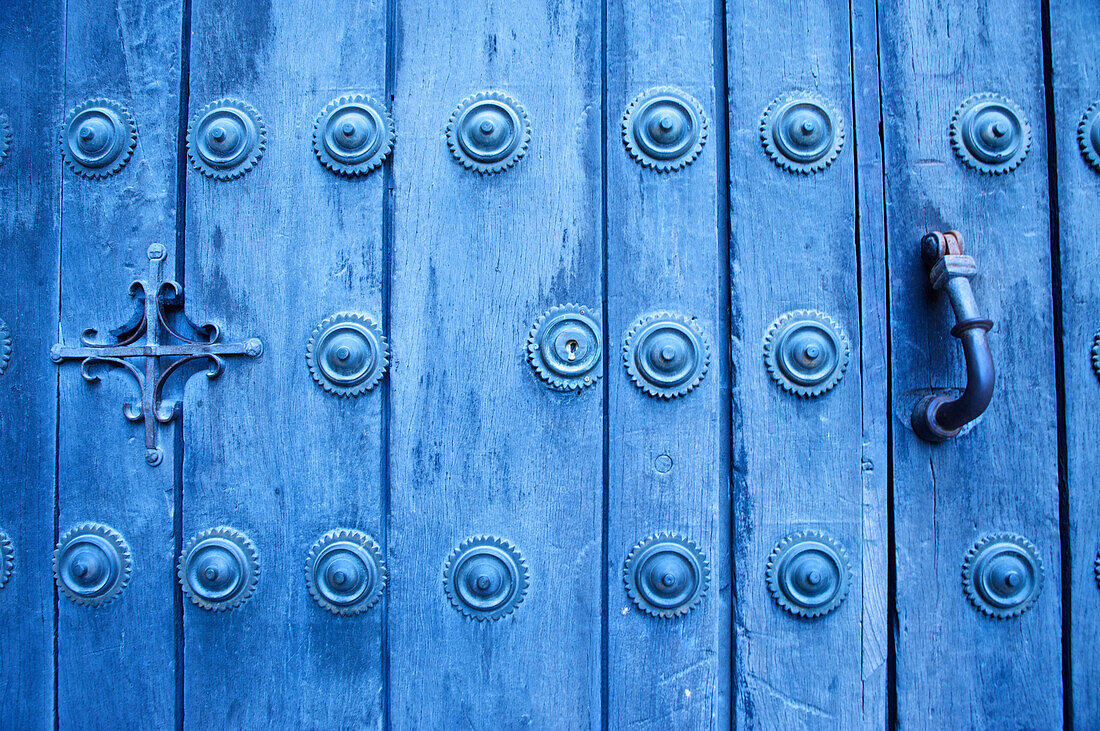 Blue door with door knocker in the wihite town of Arcos de la Frontera, Cadiz province, Andalusia, Spain, Europe