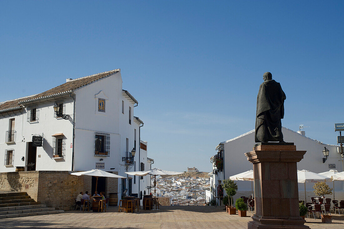 Sculpture and view over the white town, Plaza de los Escribanos, Antequera, Malaga province, Andalusia, Spain